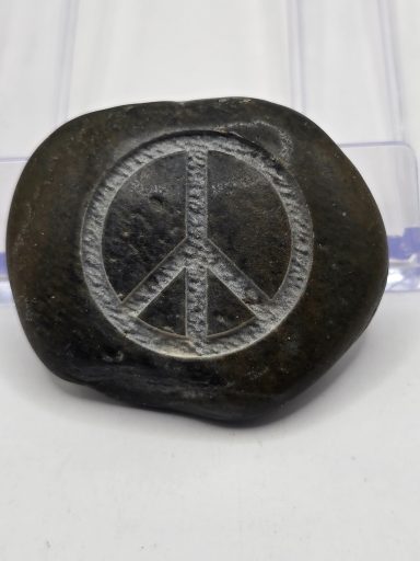 laser engraved river rock with peace sign