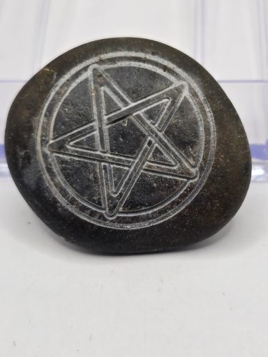laser engraved river rock with pentacle
